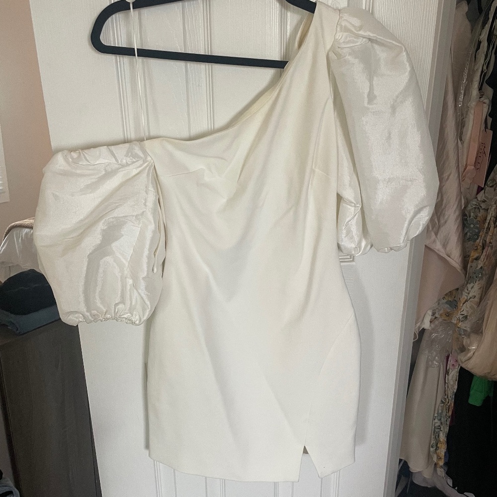 White asymmetrical mini dress perfect for a bridal shower